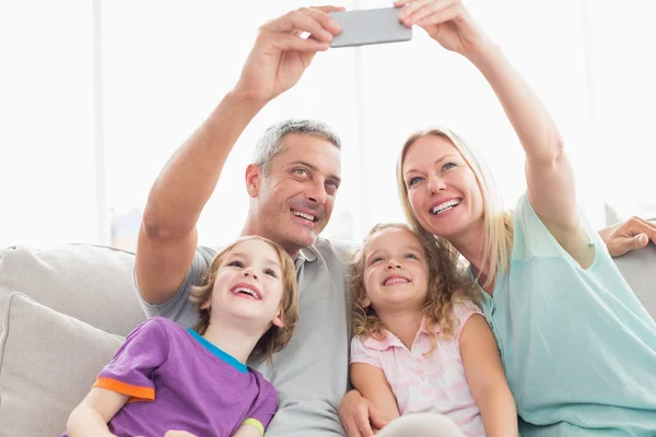 Parents taking selfie with children — Stock Photo, Image