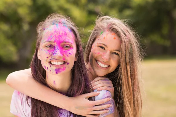 Happy friends covered in powder paint — Stock Photo, Image