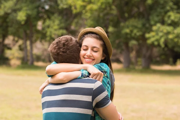 Young couple hugging in the park — Stock Photo, Image
