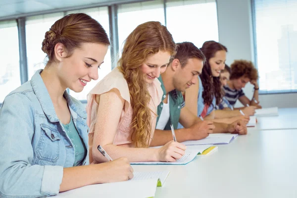 Fashion students taking notes in class — Stock Photo, Image