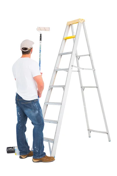 Handyman with paint roller and ladder — Stock Photo, Image