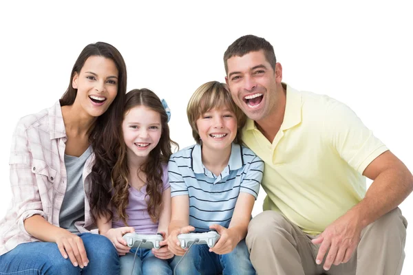 Happy family playing video game together — Stock Photo, Image