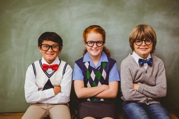 Smiling little school kids in classroom — Stock Photo, Image