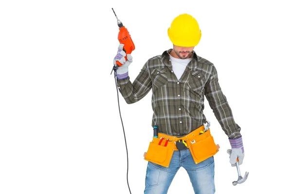 Repairman holding hammer and drill machine — Stock Photo, Image