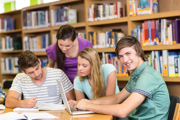 College students doing homework in library Stock Image