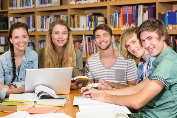 College students doing homework in library — Stock Photo, Image