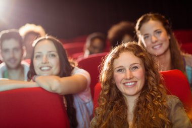 Young friends watching a film clipart