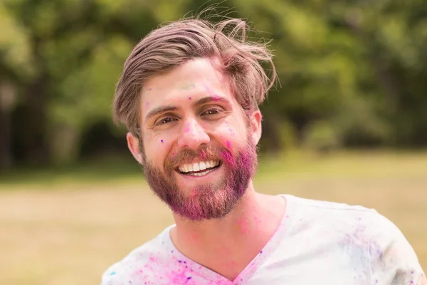 Happy man covered in powder paint — Stock Photo, Image