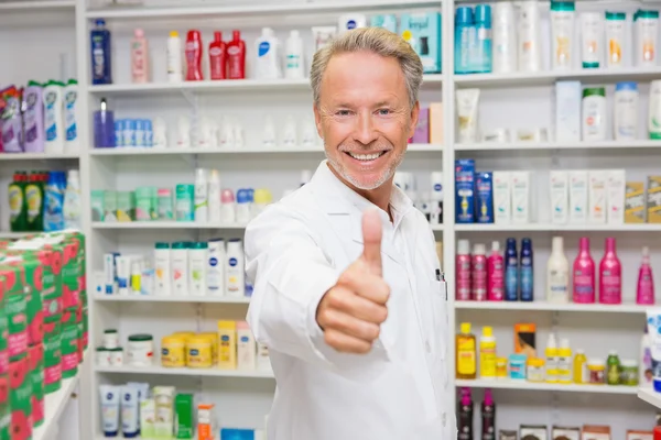 Positive pharmacist with thumb up — Stock Photo, Image