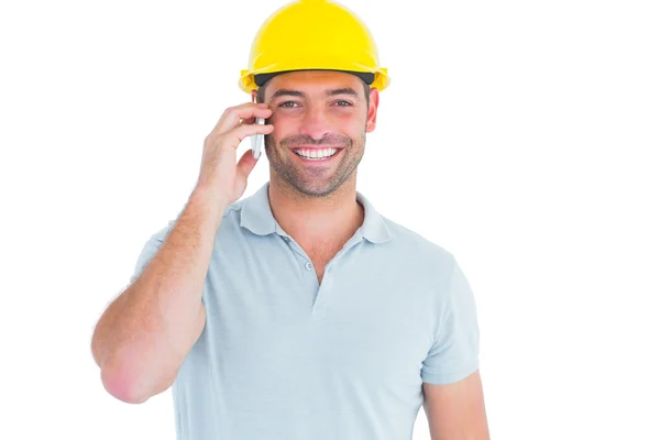 Smiling handyman talking on mobile phone — Stock Photo, Image