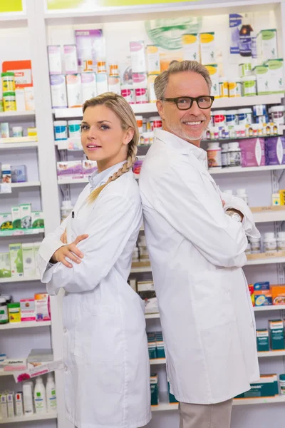 Pharmacist with his trainee standing — Stock Photo, Image