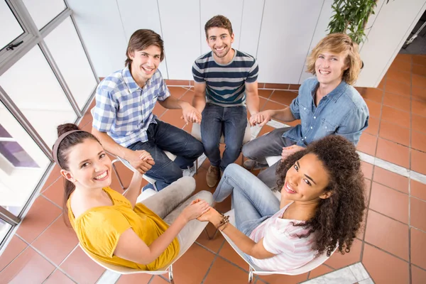 College students holding hands — Stock Photo, Image