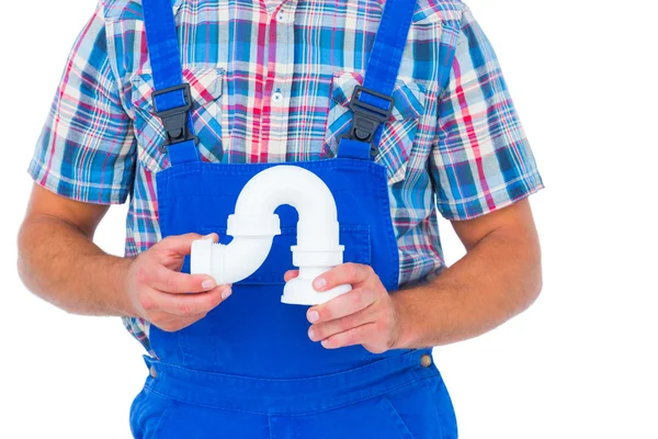 Rörmokare holding sink pipe — Stockfoto