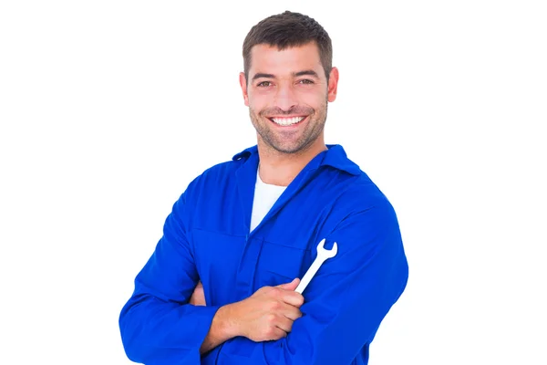 Happy mechanic holding spanner — Stock Photo, Image