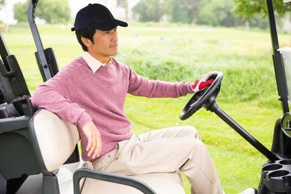 Golfer mit seinem Golf-Buggy — Stockfoto