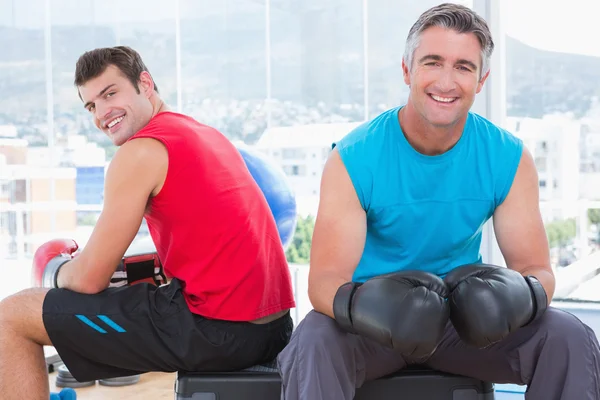 Men with box gloves smiling at camera — Stock Photo, Image