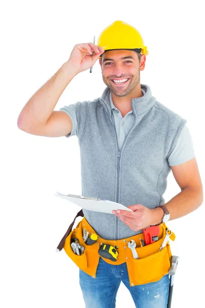 Trabajador manual sujetando portapapeles —  Fotos de Stock