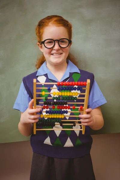 Portrét roztomilá holčička drží abacus — Stock fotografie