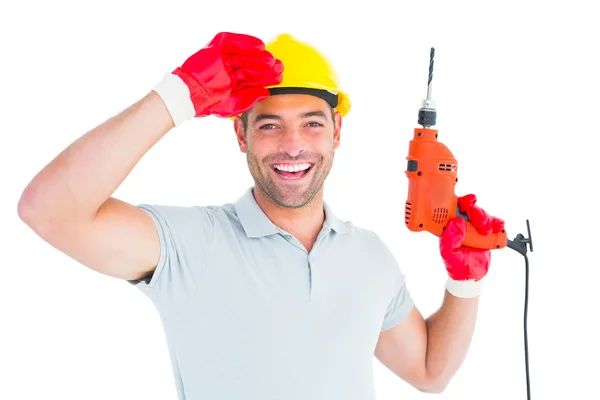 Sonriente trabajador manual sosteniendo la máquina de perforación — Foto de Stock