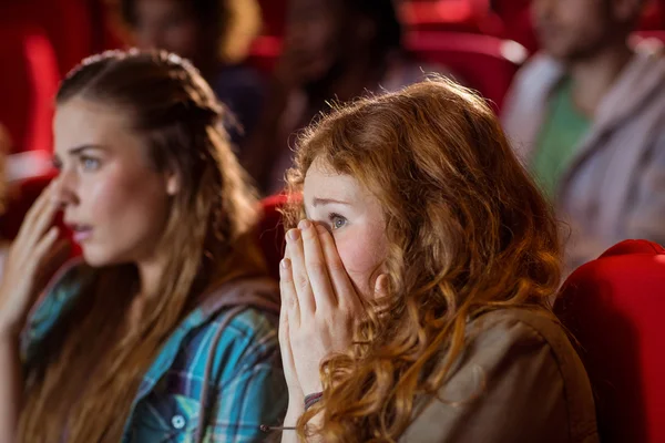 Young friends watching a film — Stock Photo, Image