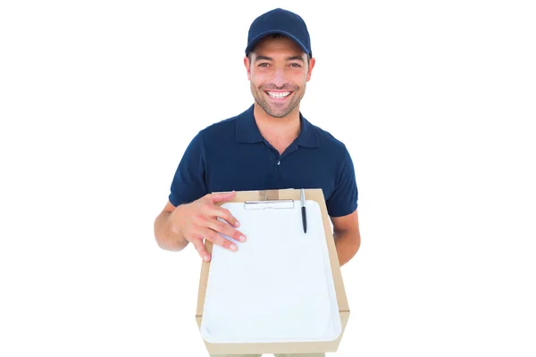 Delivery man with package and clipboard — Stock Photo, Image