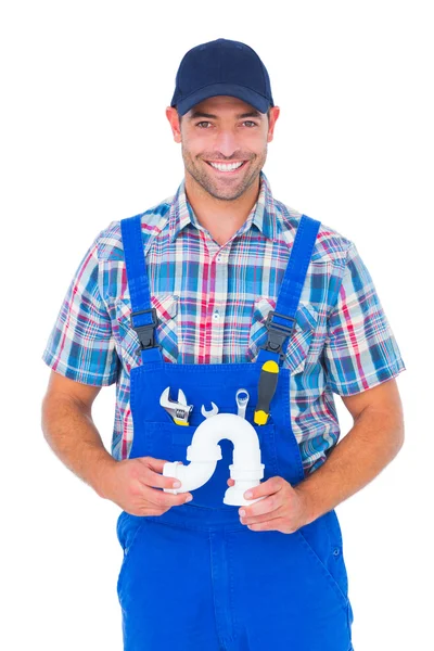 Handsome male plumber holding sink pipe — Stock Photo, Image