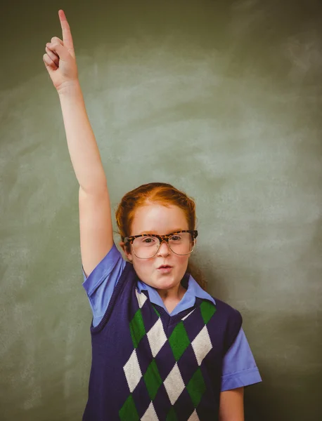 Portrait of cute little girl gesturing pointing upwards — Stock Photo, Image