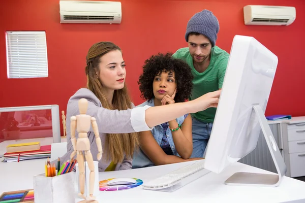Team working at desk with colour samples — Stock Photo, Image