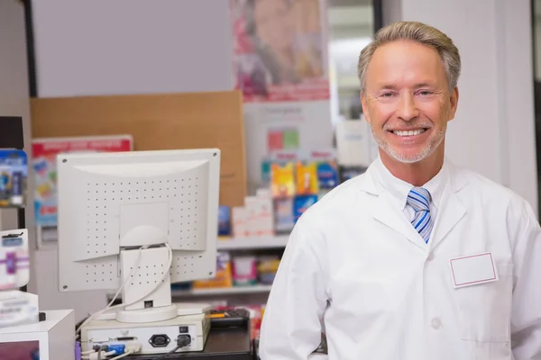 Senior pharmacist smiling at camera — Stock Photo, Image