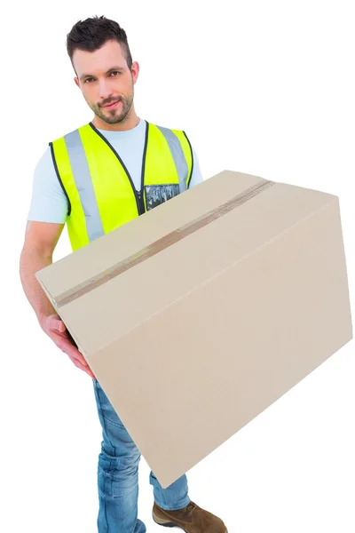 Delivery man holding cardboard box — Stock Photo, Image
