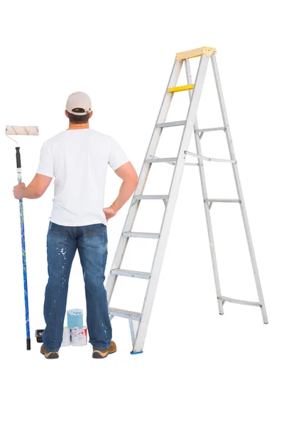 Handyman with paint roller and ladder — Stock Photo, Image