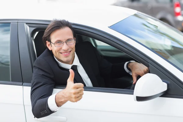 Smiling businessman with thumb up Royalty Free Stock Photos
