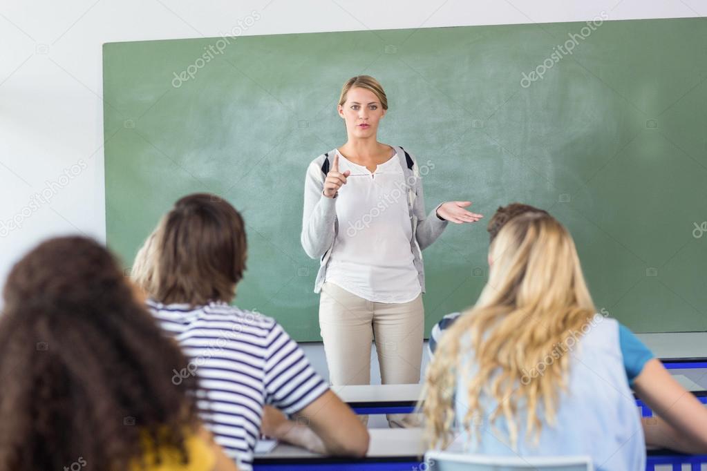 Teacher teaching students in class Stock Photo by ©Wavebreakmedia 68980051