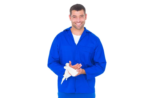 Mechanic wiping hands with cloth — Stock Photo, Image