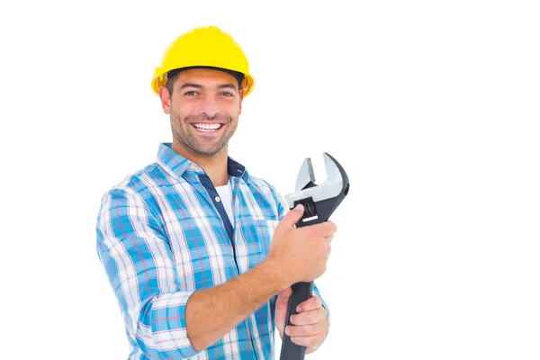 Handyman holding adjustable spanner — Stock Photo, Image