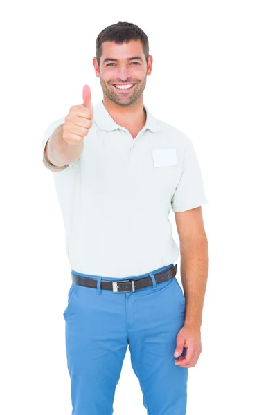 Feliz técnico masculino gesticulando polegares para cima — Fotografia de Stock