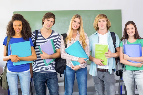 Happy college students holding folders — Stock Photo, Image