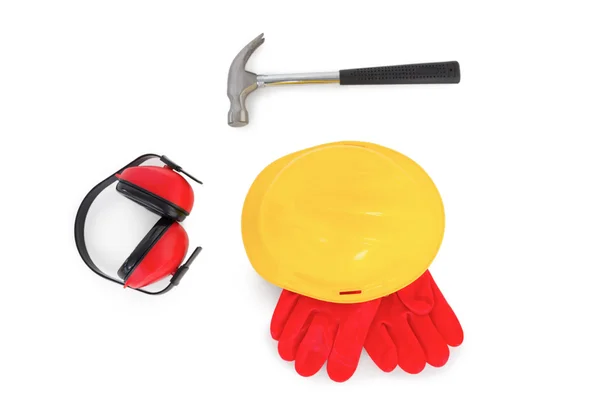 Hardhat with gloves, earmuffs and hammer — Stock Photo, Image