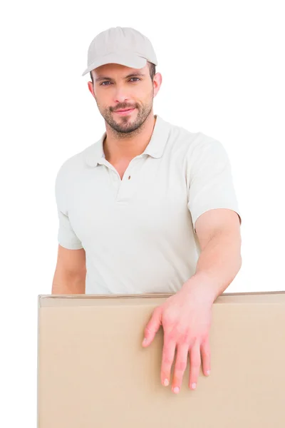 Delivery man carrying package — Stock Photo, Image