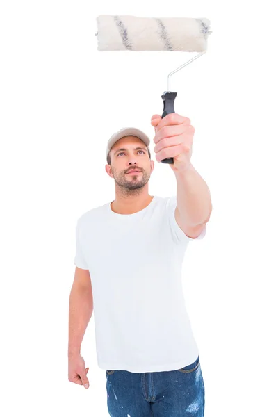 Handyman holding paint roller — Stock Photo, Image