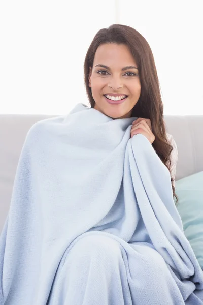 Beautiful woman wrapped with blanket — Stock Photo, Image