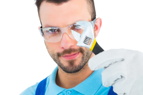 Repairman looking through adjustable wrench — Stock Photo, Image