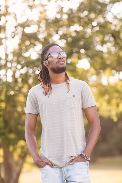 Handsome hipster in the park — Stock Photo, Image