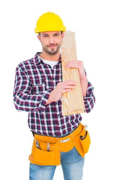 Klusjesman bedrijf houten planken — Stockfoto