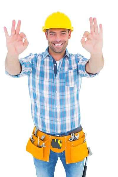 Smiling handyman gesturing okay — Stock Photo, Image
