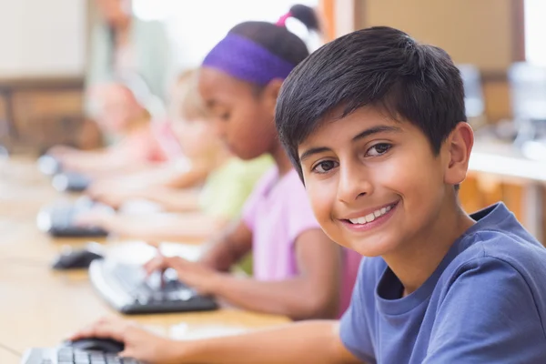 Cute pupils in computer class with teacher — Stock Photo, Image