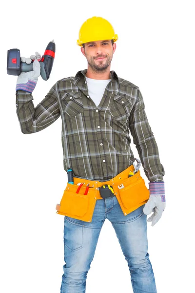 Handyman medan du håller borrmaskin — Stockfoto