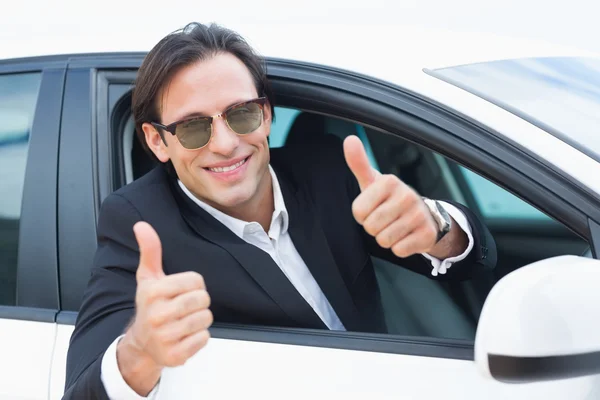 Driving businessman with thumbs up — Stock Photo, Image