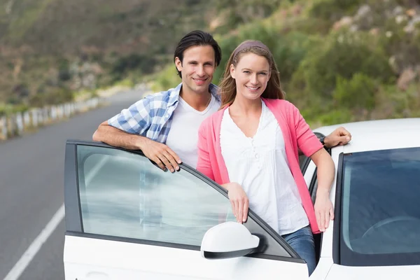 Couple smiling at the camera — Stock Photo, Image