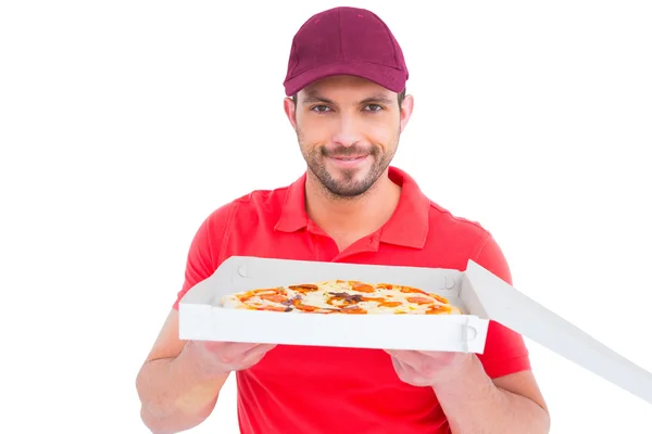 Delivery man showing fresh pizza — Stock Photo, Image